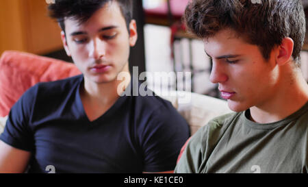 Two young men talking and chatting Stock Photo