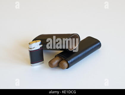 Still life with a cigar lighter and a leather case isolated on white background Stock Photo