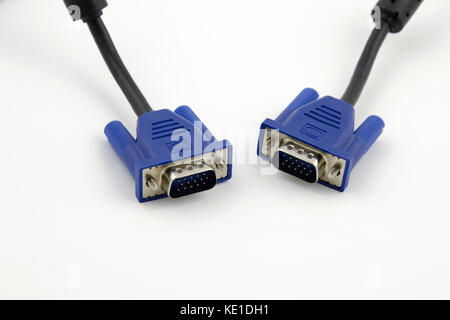 Detailed view of two VGA video connectors with black cables on a white background Stock Photo