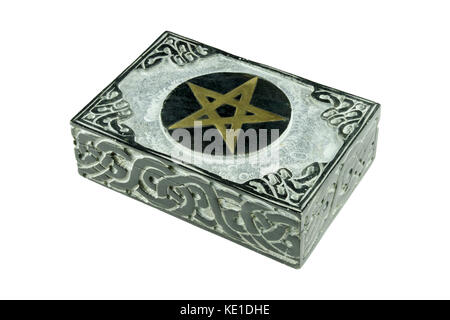 Still life with closed stone esoteric mystic box with carved sign pentagram and ornaments isolated on white background Stock Photo