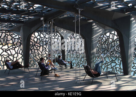 MARSEILLE, FRANCE, OCTOBER 2, 2014 : Visitors rest inside the Museum of European and Mediterranean Civilizations in Marseille. MuCEM was inaugurated o Stock Photo