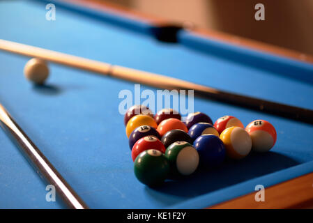 Billiard balls in a blue pool table Stock Photo