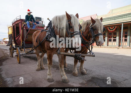 December 9, 2015 Tombstone, Arizona, USA: Horse drawn carriage waiting for customers on the main street of the historic western town founded in 1879 Stock Photo