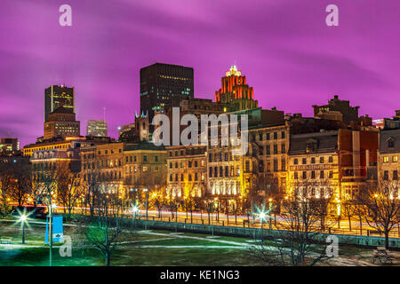 The Old Port section of Montreal City at night with a dramatic and colorful sky in Quebec Province, Canada, North America. Stock Photo