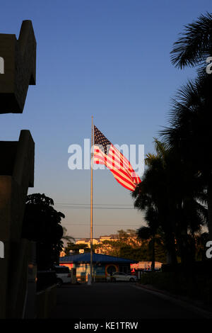 The American flag at sunset at Siesta Key in Sarasota FL Stock Photo