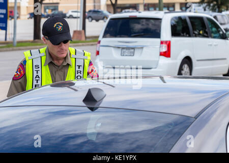 Texas State Trooper speaking with a car drive Stock Photo