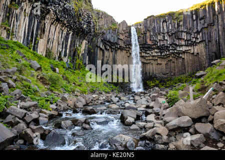 Svartifoss waterfall from above, with basalt columns, Iceland in summer, water in motion blur. Stock Photo