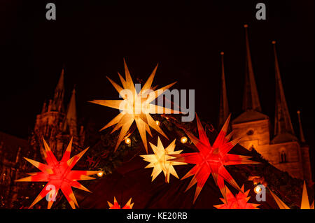 Christmas fair on the Domplatz in Erfurt: Lighting stars in front of cathedral and Severi-Church, Thuringia, Germany Stock Photo