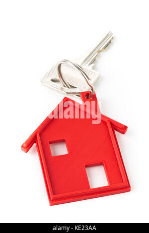 House door key with red house key chain pendant over white background Stock Photo