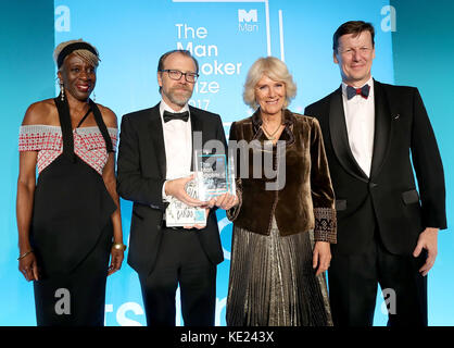 (Left-right) Baroness Lola Young, winning author George Saunders, the Duchess of Cornwall and Man Group CEO Luke Ellis on stage at the Guildhall in London, during the 2017 Man Booker award ceremony. Stock Photo