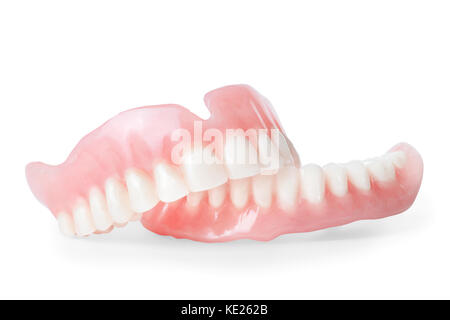 Set of false teeth. Isolated on white, clipping path included Stock Photo