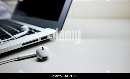 laptop and headsets Stock Photo