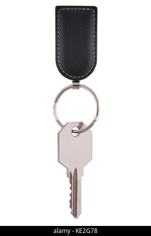Key hangs on black keyring. Isolated on white, clipping path included. Stock Photo