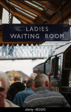 A sign hanging from a platform at a train station that reads, 'Ladies Waiting Room', UK Stock Photo