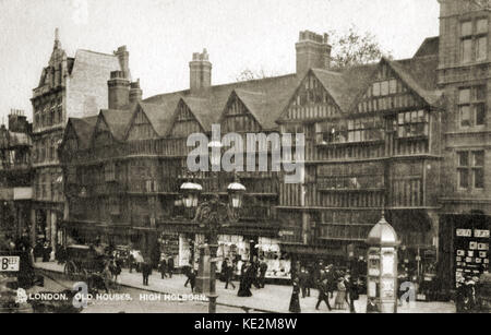 Holborn, old houses on High Holborn, central  London - busy street with horses and carriages, people walking and shopping. Postcard. Stock Photo