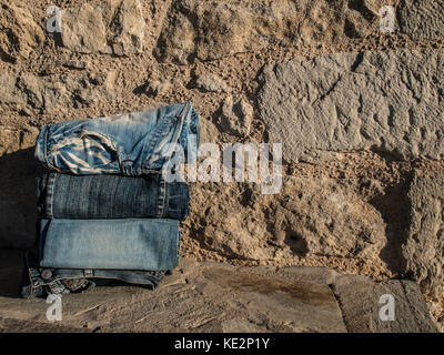 jeans with stone wall background Stock Photo