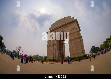 DELHI, INDIA - SEPTEMBER 19, 2017: Wide angle of the picture and unidentified people walking in front of the India Gate, formerly known as the All India War Memorial at Rajpath, New Delhi Stock Photo