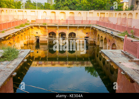 Jaipur, India - September 20, 2017: Old temple reflected in the water, Galta ji Temple Jaipur Rajasthan Stock Photo