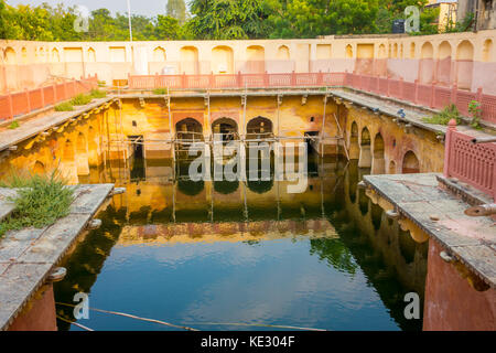 Jaipur, India - September 20, 2017: Old temple reflected in the water, Galta ji Temple Jaipur Rajasthan Stock Photo