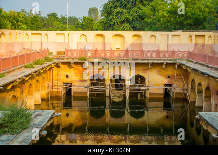 Jaipur, India - September 20, 2017: Old temple reflected in the water, Galta ji Temple Jaipur Rajasthan Stock Photo