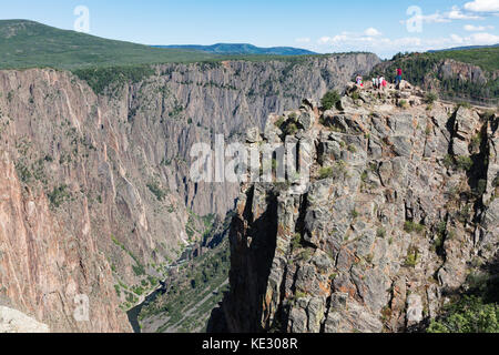 Tourists taking in the view of Black River and Black Canyon of the Gunnison, Black Canyon of the Gunnison National Park, Colorado, USA Stock Photo