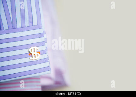 Cufflinks in a $ sign. Cufflinks dollar. Gold cufflinks. Stock Photo
