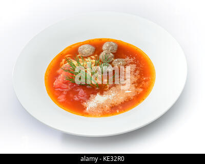 Red soup with meatballs in white dish on white Stock Photo