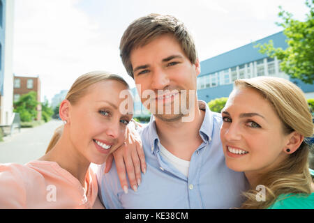 Group Of Young Male And Female College Students Classmates Standing ...