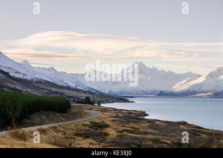 Mount cook viewpoint with the lake pukaki and the road leading to mount cook village. Taken during summer in New Zealand. Stock Photo