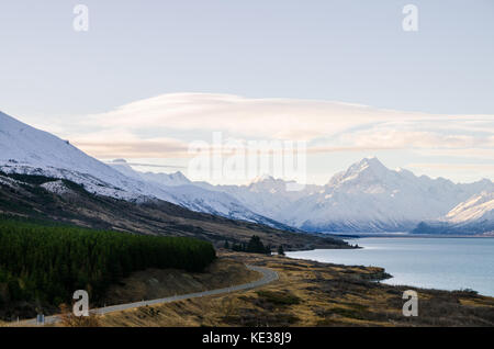 Mount cook viewpoint with the lake pukaki and the road leading to mount cook village. Taken during summer in New Zealand. Stock Photo