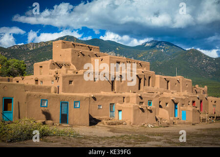 Taos Pueblo (or Pueblo de Taos) in New Mexico is an ancient pueblo belonging to a Tiwa-speaking Native American tribe of Puebloan people. Stock Photo