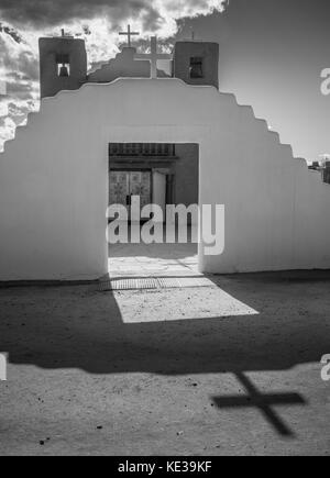 Taos Pueblo (or Pueblo de Taos) in New Mexico is an ancient pueblo belonging to a Tiwa-speaking Native American tribe of Puebloan people. Stock Photo