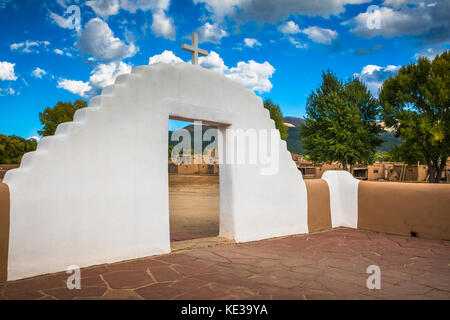 Taos Pueblo (or Pueblo de Taos) in New Mexico is an ancient pueblo belonging to a Tiwa-speaking Native American tribe of Puebloan people. Stock Photo