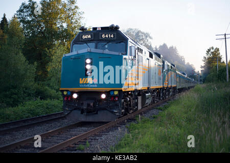 VIA Rail Canadian passing through Burnaby, BC, Canada Stock Photo