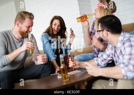 Young students and friends celebrating ahd having fun while drinking Stock Photo