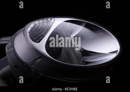 modern round headlights of car on black background isolated Stock Photo