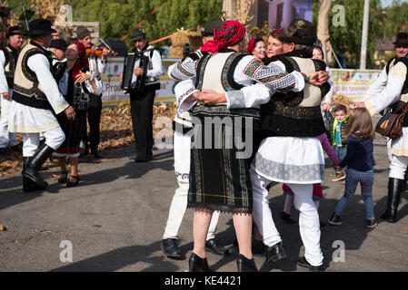 CLUJ NAPOCA, ROMANIA - OCTOBER 15, 2017: Romanian folk dancers performing a dance in traditional costumes in the Autumn Fair Stock Photo