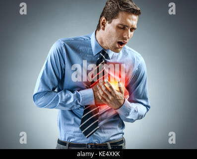 Office manager having heart attack. Medical concept. Stock Photo