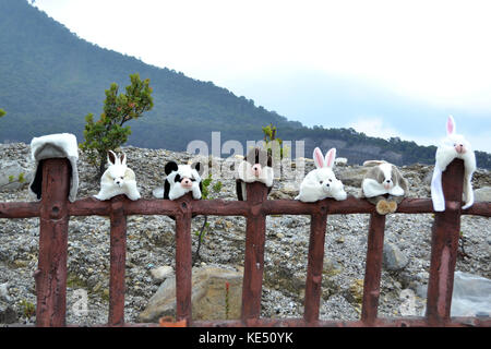 People selling some souvenirs around Tangkuban Perahu. This one sells cute hat. Pic was taken in November 2015. Stock Photo