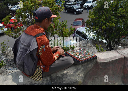 People selling some souvenirs around Tangkuban Perahu. This one sells jewelry (agate or 'batu akik', once really famous). Pic was taken in November 20 Stock Photo