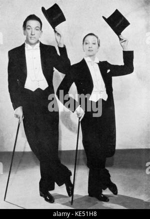 Noel Coward & Gertrude Lawrence in the musical 'The Red Peppers', 1936. NC, English actor, playwright, & composer: 16 December 1899 - 26 March 1973. GL, English actress & musical performer: 4 June 1898 - 6 September 1952. Top hats. Stock Photo