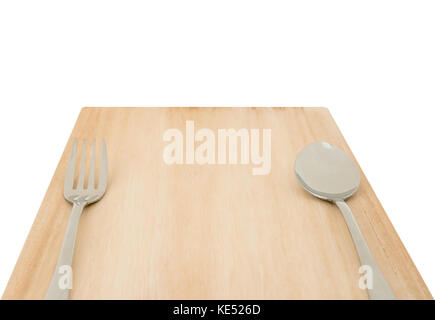 Wood cutting board and set of fork and spoon isolated on white background with clipping path Stock Photo