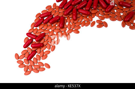 Red vitamins and supplements capsule and iron tablets isolated on white background with copy space and clipping path. Use for topics content about tre Stock Photo