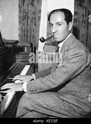 George Gershwin - playing piano with pipe in his mouth.   American composer & pianist, 26th September 1898 - 11th July 1937 Stock Photo