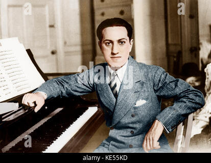 George GERSHWIN - portrait leaning on piano with open score page . . American composer and pianist 26th September 1898 - 11th July 1937. Colourised version. Stock Photo