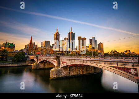 Sunset over skyline of Melbourne downtown, Princess Bridge and Yarra River Stock Photo