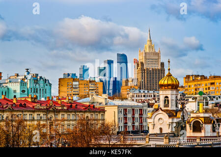 View of Moscow city on a sunny autumn day. Old and new houses, small historic buildings and a modern skyscrapers Stock Photo