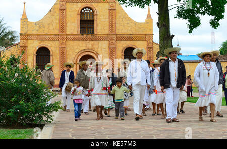 Locals dressed in festive costumes on the day of tradition in front of the Jesuit mission, Jesuit reduction Stock Photo