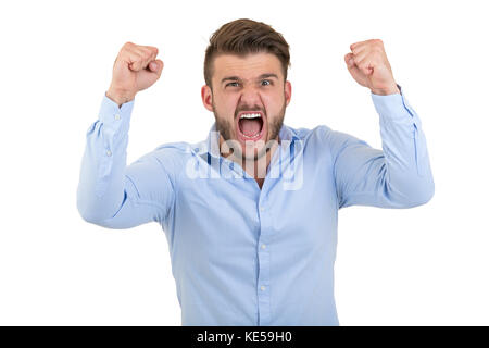 Image of screaming angry young bearded emotional man standing over white wall background isolated. Stock Photo