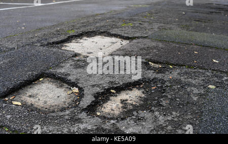 Pothole in road causing misery for motorist Stock Photo